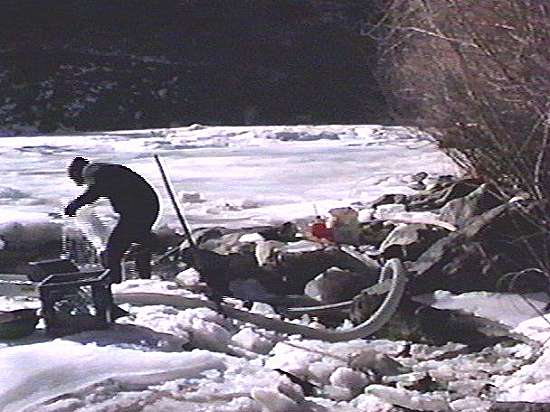 Clearing out the ice from the dredge hole